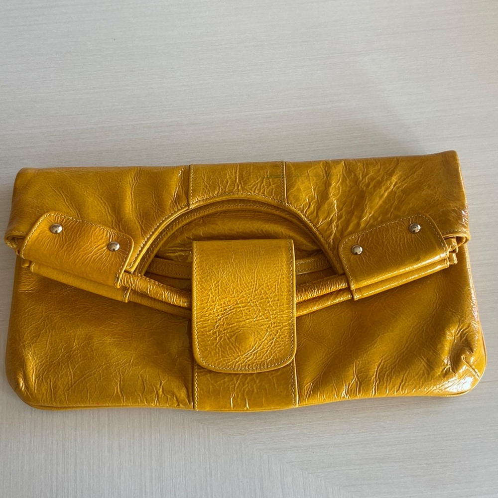 Lorelei yellow leather handbag clutch with gold hardware and pink interior